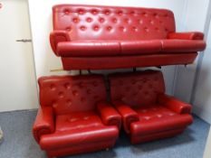 A RETRO RED BUTTON BACK UPHOLSTERED THREE PIECE LOUNGE SUITE in near mint condition, 80 cms high,
