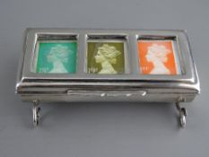A SILVER TROUGH FORM TRIPLE STAMP HOLDER, late Victorian (marks rubbed, soldered repairs to feet),