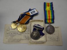 Two WWI medals to E Yates together with a WWII medal with Palestine clasp for Hollister together