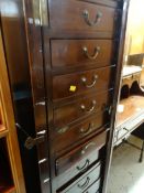 An unusual mahogany Wellington-type chest with a bank of twelve drawers & gallery top