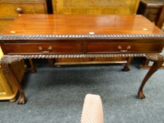 A reproduction carved side table with two drawers