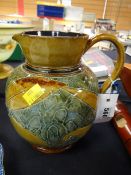 A Doulton Lambeth stoneware leaf decorated vase, initialled by Edith Barlow