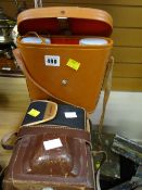 A pair of binoculars in leather case together with a vintage Ilford camera & a Canon camera