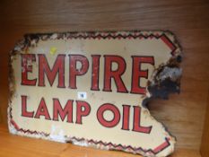 An enamel sign for Empire Lamp Oil (damage)
