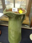 An Ewenny Clay Pits pottery 'Blodau Hyfryd' green ground jug