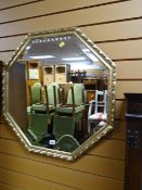 An octagonal bevelled gilt framed wall mirror