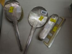 A four-piece machine turned silver dressing table set (damage)