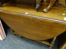 A large drop leaf barley-twist gate leg table