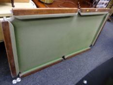 A quarter size slate bed snooker table