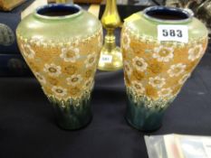 A pair of Doulton Lambeth lace work baluster vases