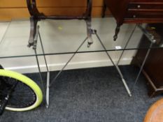 A modern chrome & glass console table