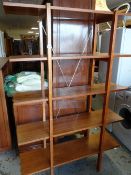 A modern teak effect standing shelf unit