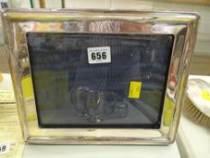 A plain silver easel portrait frame