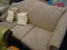 A vintage Parker Knoll three-seater sofa with gold floral upholstery
