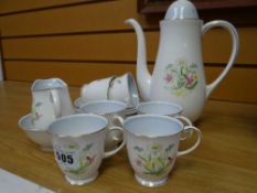 A Susie Cooper floral decorated coffee set