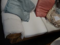 A three-seater rattan rolled arm & back sofa with loose covers