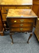 An antique / reproduction three-drawer twin flap table