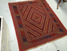 A blue & red patterned Gazak rug, 133 x 120cms