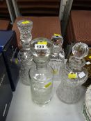 Four various good quality cut glass decanters