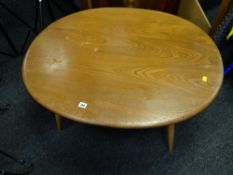 A mid-century lightwood Ercol oval coffee table