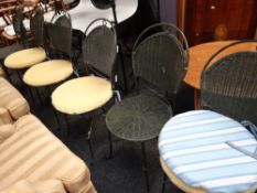 A modern set of six metal garden chairs