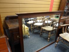 A vintage bevelled overmantel mirror