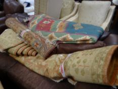 A large pale ground floral patterned rug together with a modern South American patterned rug &