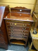An antique mahogany music cabinet