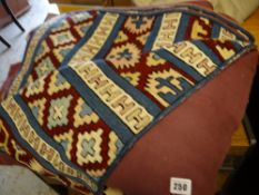 Two woollen crewelwork-style rugs together with another modern rug