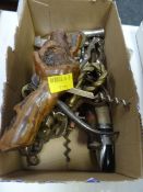 A collection of corkscrews, bottle openers & a nutcracker etc