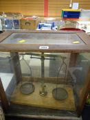 A vintage cased set of laboratory scales (distressed)