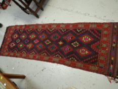 A multi-coloured geometric designed Suzni Killim runner, 212 x 63cms