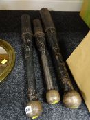 Three large cast iron exercise clubs