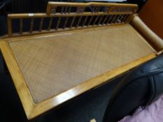 An Oriental hardwood daybed with scroll end