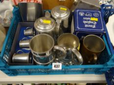 A small crate of pewter items including tankards of various sizes