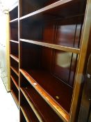 A pair of modern Oriental hardwood tall open bookcases