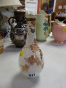 An early twentieth century Satsuma pottery gilded & enamelled garden decorated narrow neck vase