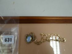 A moonstone pendant on a 9ct gold cable necklace, 15grams gross