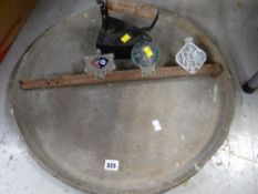 A trio of motoring grill badges, an old flat iron etc