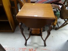 A drop flap occasional table with planter stand base