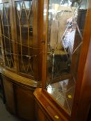 A reproduction standing two-door corner cabinet, a similar single-door yew reproduction corner