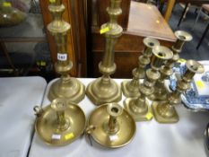 Three pairs of brass candlesticks together with a nice pair of brass chamber sticks
