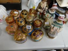A collection of highly decorative musical trinket boxes & four continental figures