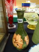A Moorcroft green ground Slipper Orchid patterned narrow necked vase