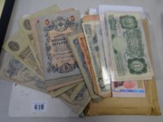 A collection of early Russian & other bank notes together with a quantity of loose stamps divided