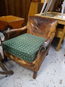 A vintage brown leather armchair (distressed)
