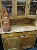 A compact semi-glazed vintage pine dresser