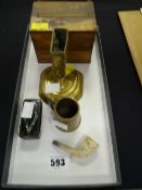A nineteenth century brass vesta stand, a papier mache snuff box, a clay pipe etc