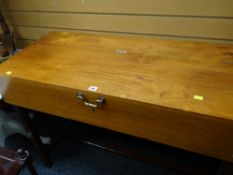 A vintage coffin table with lift up top