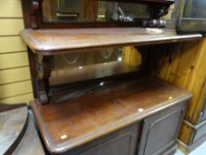 An antique mahogany mirror back sideboard